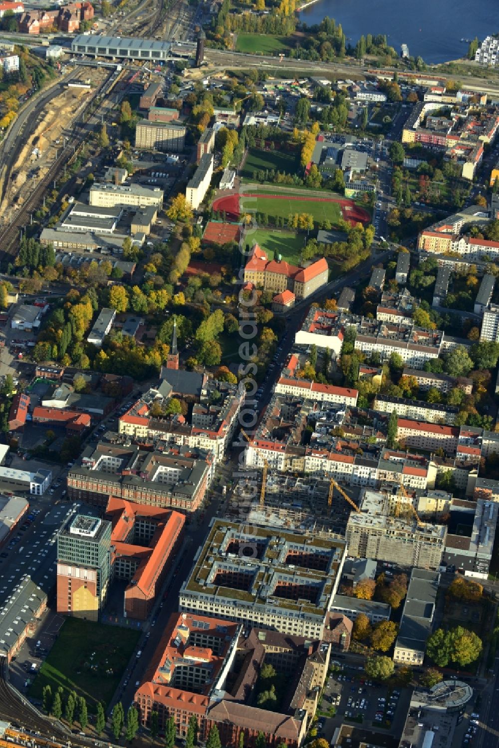 Berlin from above - View the construction site of the new building of a residential house with condominiums on the Oberbaum City in the district Friedrichshain in Berlin. It is a project of the AccoNarva Engineering Ltd. The bodyshell has been commissioned by the ANES Construction Work Berlin GmbH