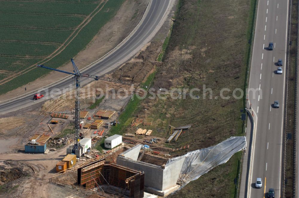 Aerial image Eisenach - Blick auf die Baustelle der Ausfahrt / Anschlussstelle Eisenach-West der A4. Hier eine Überführung zur B7 im Südteil. Der Neubau ist Teil des Projekt Nordverlegung / Umfahrung Hörselberge der Autobahn E40 / A4 in Thüringen bei Eisenach. Durchgeführt werden die im Zuge dieses Projektes notwendigen Arbeiten unter an derem von den Mitarbeitern der Niederlassung Weimar der EUROVIA Verkehrsbau Union sowie der Niederlassungen Abbruch und Erdbau, Betonstraßenbau, Ingenieurbau und TECO Schallschutz der EUROVIA Beton sowie der DEGES.