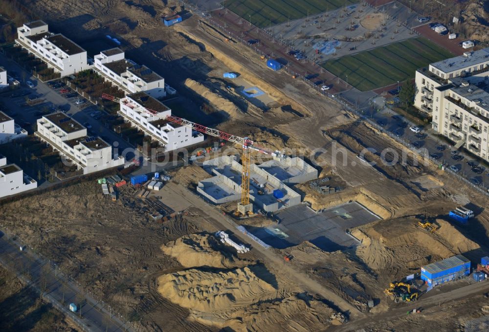 Berlin from the bird's eye view: Construction site of new houses in Truman-Allee in Berlin-Steglitz. The company responsible for the construction is NCC Germany GmbH