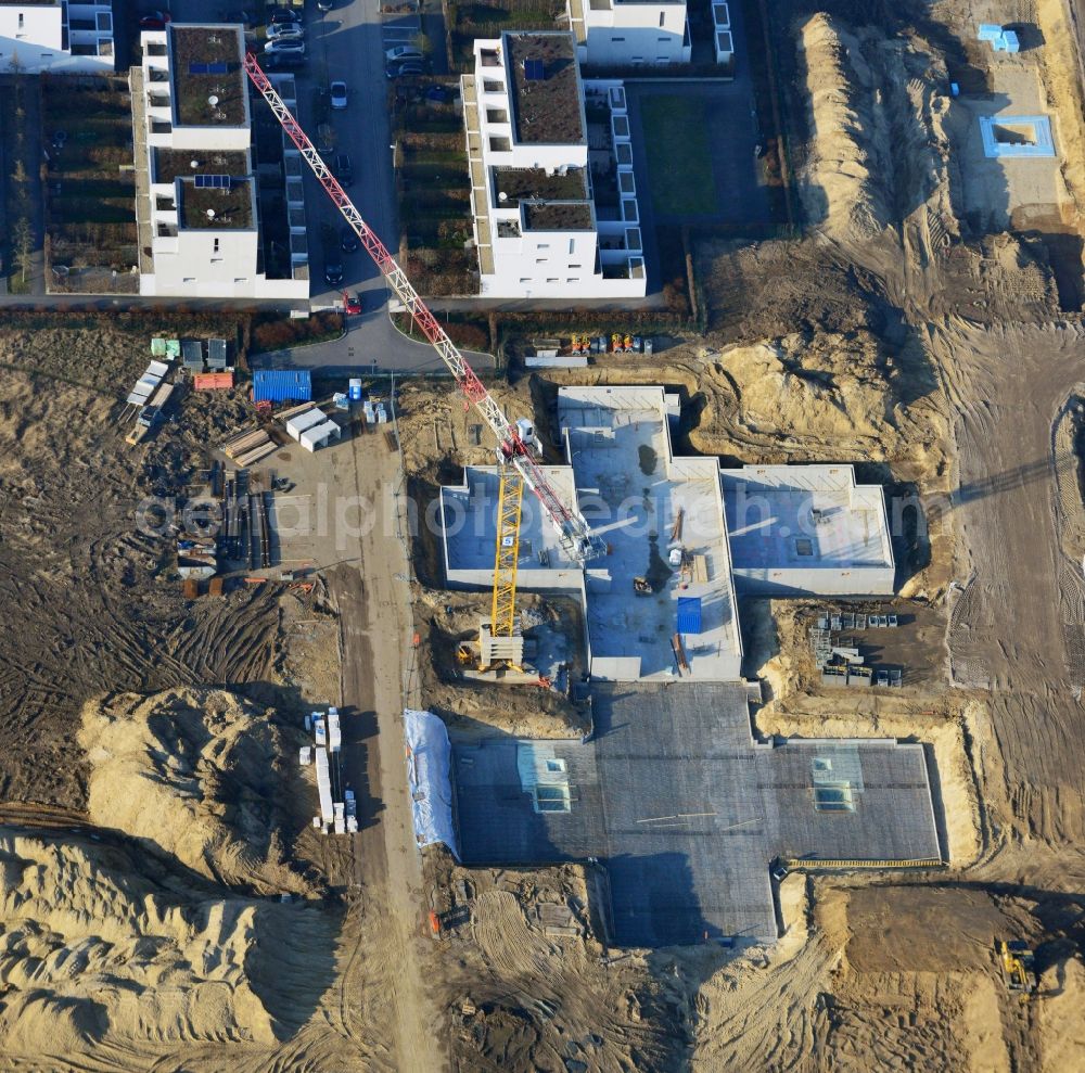 Aerial photograph Berlin - Construction site of new houses in Truman-Allee in Berlin-Steglitz. The company responsible for the construction is NCC Germany GmbH