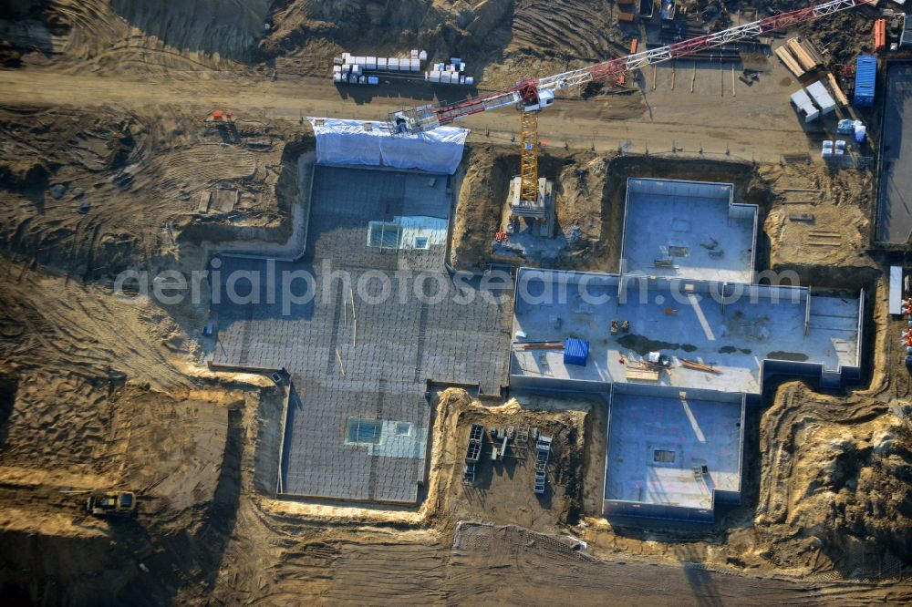 Berlin from the bird's eye view: Construction site of new houses in Truman-Allee in Berlin-Steglitz. The company responsible for the construction is NCC Germany GmbH