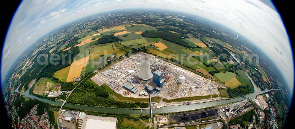 Aerial image Datteln - Fish Eye Blick auf die Baustelle des neuen Steinkohlekraftwerk Datteln / Castrop-Rauxel im Ruhrgebiet am Dortmund-Ems-Kanal. Der Kraftwerksneubau ist auch bekannt als EON Datteln 4. Datteln 4 geht 2012 als Monoblockanlage mit einer Bruttoleistung von 1.100 MW in Betrieb und ersetzt die Blöcke 1 bis 3 in Datteln und Shamrock in Herne, die ihr technisch-wirtschaftliches Laufzeitende erreichen werden. Snowy winter construction site of new coal-fired power plant dates on the Dortmund-Ems Canal.