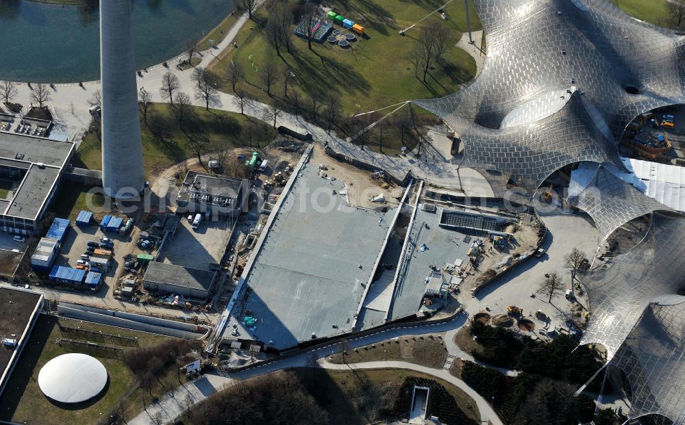 Aerial photograph München - Die Baustelle der neuen Kleinen Olympiahalle neben dem Olympiaturm in München. Die Halle ist ein Projekt des Architektenbüros Auer + Weber + Assosizierte und der Xaver Riebel Bauunternehmung GmbH. The construction site of the new Small Olympic Hall next to the Olympic Tower in Munich.