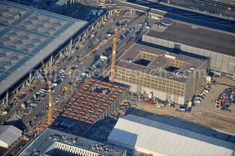 Schönefeld from above - Construction site of the new terminal at Schönefeld Airport ( BBI or BER , sobriquet: Willy Brandt ). The new terminal will be built in the south of the airport Berlin - Schönefeld. Executing companies: Hochtief AG; EUROVIA Beton; PORR; BERGER Bau; Karl Weiss; Matthai; Schäler Bau Berlin GmbH; STRABAG