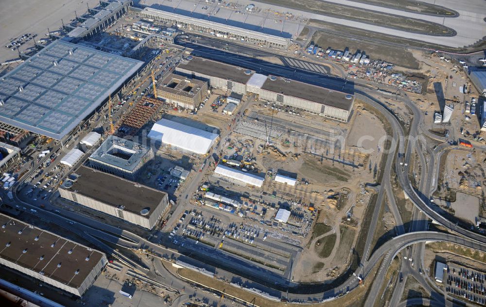 Schönefeld from the bird's eye view: Construction site of the new terminal at Schönefeld Airport ( BBI or BER , sobriquet: Willy Brandt ). The new terminal will be built in the south of the airport Berlin - Schönefeld. Executing companies: Hochtief AG; EUROVIA Beton; PORR; BERGER Bau; Karl Weiss; Matthai; Schäler Bau Berlin GmbH; STRABAG