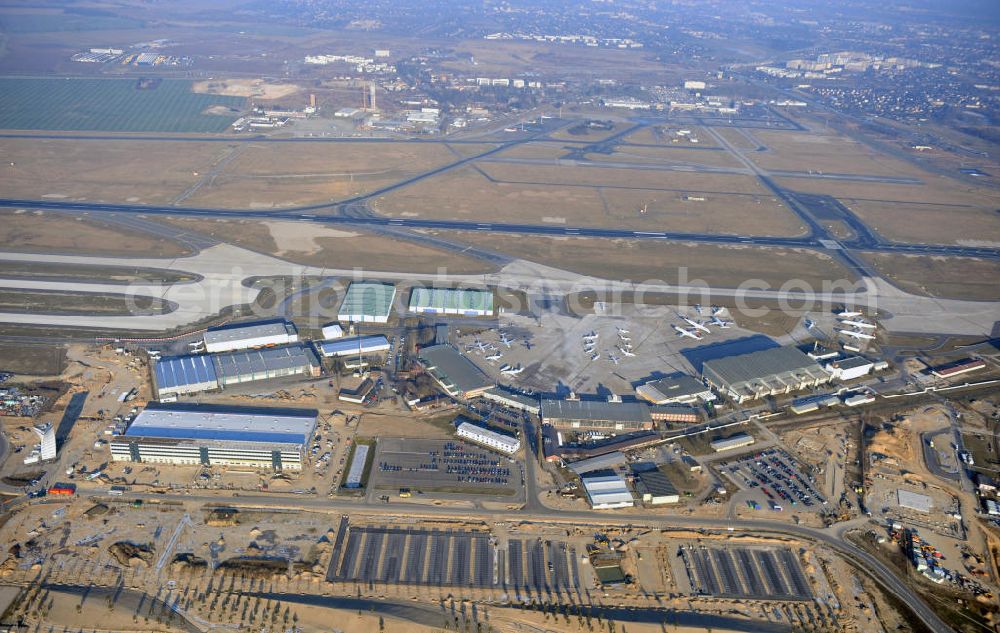 Aerial image Schönefeld - Construction site of the new terminal at Schönefeld Airport ( BBI or BER , sobriquet: Willy Brandt ). The new terminal will be built in the south of the airport Berlin - Schönefeld. Executing companies: Hochtief AG; EUROVIA Beton; PORR; BERGER Bau; Karl Weiss; Matthai; Schäler Bau Berlin GmbH; STRABAG