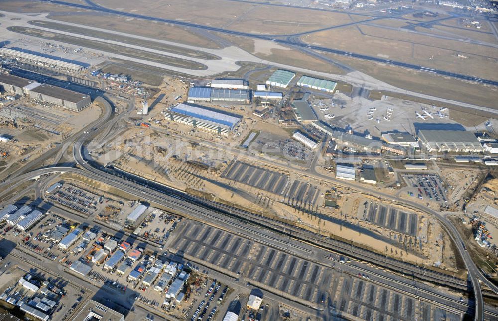 Aerial photograph Schönefeld - Construction site of the new terminal at Schönefeld Airport ( BBI or BER , sobriquet: Willy Brandt ). The new terminal will be built in the south of the airport Berlin - Schönefeld. Executing companies: Hochtief AG; EUROVIA Beton; PORR; BERGER Bau; Karl Weiss; Matthai; Schäler Bau Berlin GmbH; STRABAG