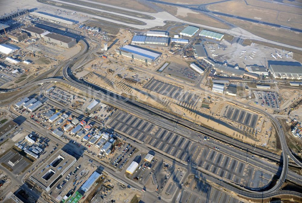 Schönefeld from above - Construction site of the new terminal at Schönefeld Airport ( BBI or BER , sobriquet: Willy Brandt ). The new terminal will be built in the south of the airport Berlin - Schönefeld. Executing companies: Hochtief AG; EUROVIA Beton; PORR; BERGER Bau; Karl Weiss; Matthai; Schäler Bau Berlin GmbH; STRABAG