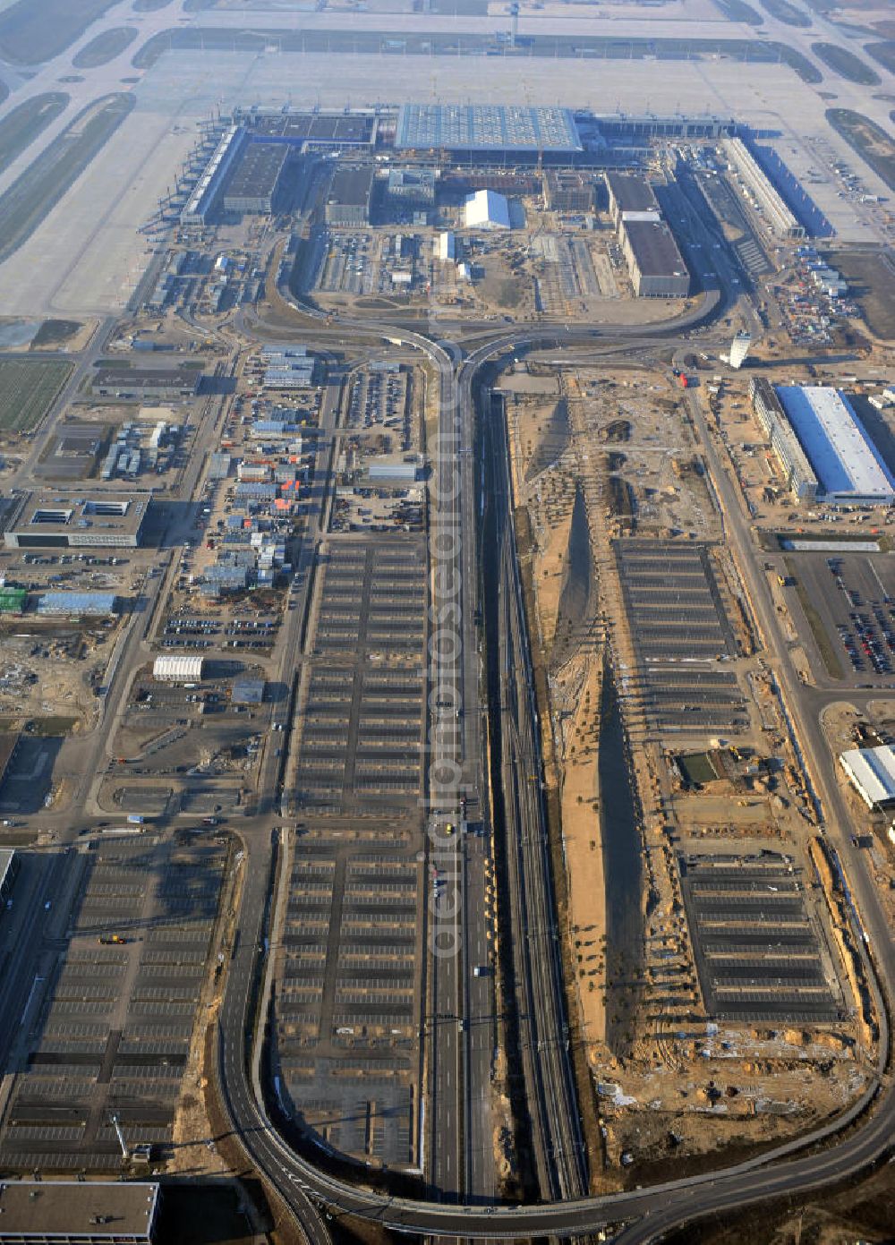 Aerial image Schönefeld - Construction site of the new terminal at Schönefeld Airport ( BBI or BER , sobriquet: Willy Brandt ). The new terminal will be built in the south of the airport Berlin - Schönefeld. Executing companies: Hochtief AG; EUROVIA Beton; PORR; BERGER Bau; Karl Weiss; Matthai; Schäler Bau Berlin GmbH; STRABAG