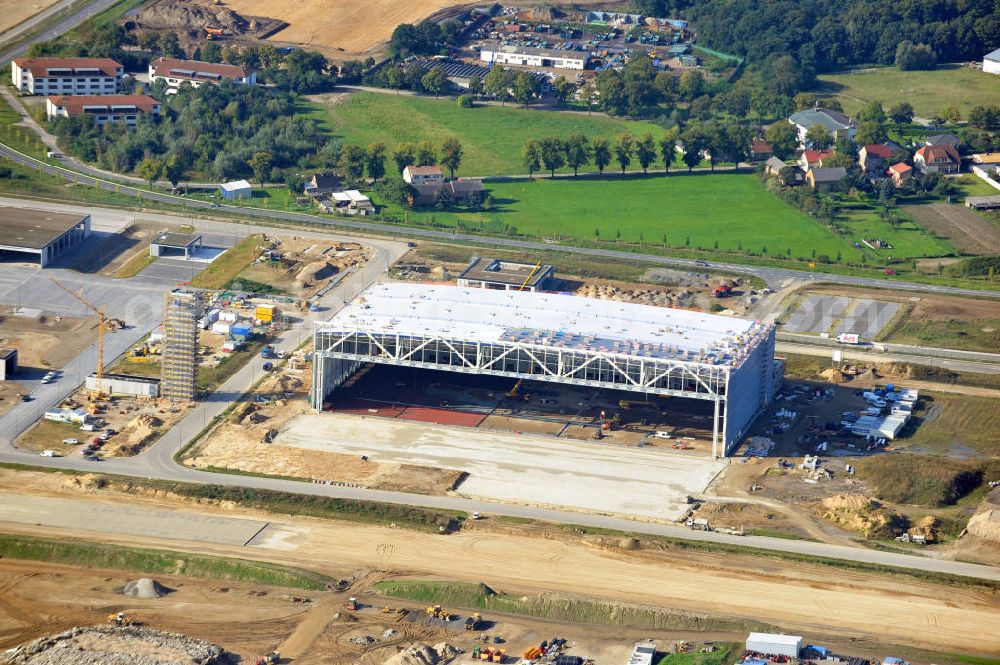 Berlin Schönefeld from the bird's eye view: Baustelle des neuen Terminals am Flughafen Schönefeld (BBI). Der neue Terminal wird südlich des jetzigen Flughafens Berlin- Schönefeld errichtet. Ausführende Firmen: Hochtief AG; EUROVIA Beton; PORR; BERGER Bau; Karl Weiss; Matthai; Schäler Bau Berlin GmbH; STRABAG; Construction area of the new terminal at Schönefeld Airport (BBI). The new terminal is in the south of the airport Berlin -Schoenefeld quality built. Exporting companies: Hochtief AG; EUROVIA Beton; PORR; BERGER Bau; Karl Weiss; Matthai; Schäler Bau Berlin GmbH; STRABAG;