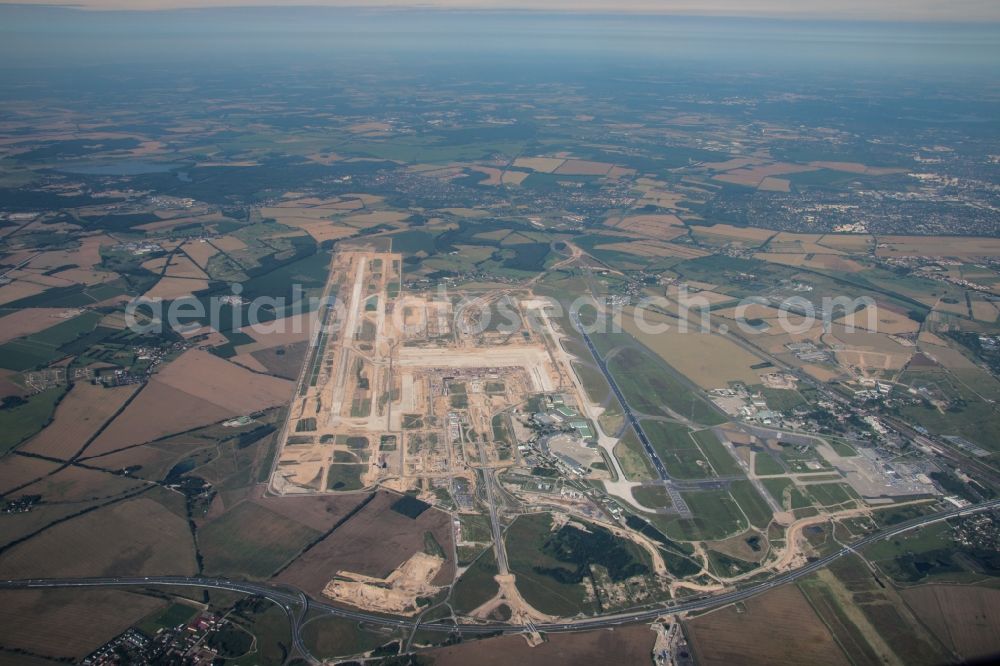 Schönefeld from the bird's eye view: Construction area of the new terminal at Schoenefeld Airport (BBI). The new terminal is in the south of the airport Berlin -Schoenefeld quality built. Exporting companies: Hochtief AG; EUROVIA Beton; PORR; BERGER Bau; Karl Weiss; Matthai; Schaeler Bau Berlin GmbH; STRABAG;