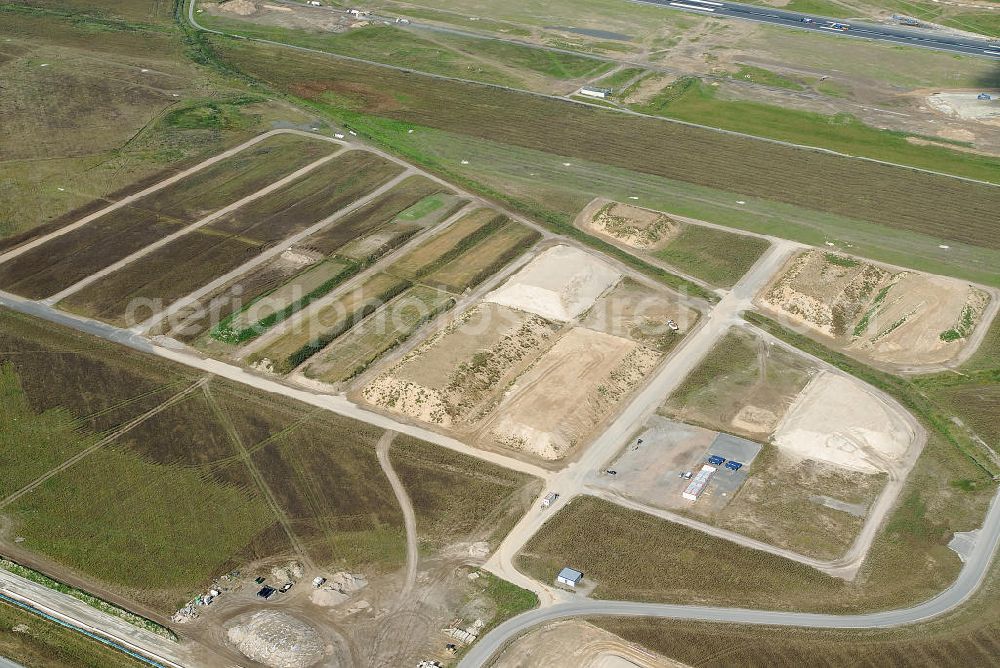 Schönefeld from the bird's eye view: Baustelle des neuen Terminals am Flughafen Schönefeld (BBI). Der neue Terminal wird südlich des jetzigen Flughafens Berlin- Schönefeld errichtet. Ausführende Firmen: Hochtief AG; EUROVIA Beton; PORR; BERGER Bau; Karl Weiss; Matthai; Schäler Bau Berlin GmbH; STRABAG; MAX BÖGL. Construction area of the new terminal at Schönefeld Airport (BBI). The new terminal is in the south of the airport Berlin-Schoenefeld quality built. Exporting companies: Hochtief AG; EUROVIA Beton; PORR; BERGER Bau; Karl Weiss; Matthai; Schäler Bau Berlin GmbH; STRABAG; MAX BÖGL.