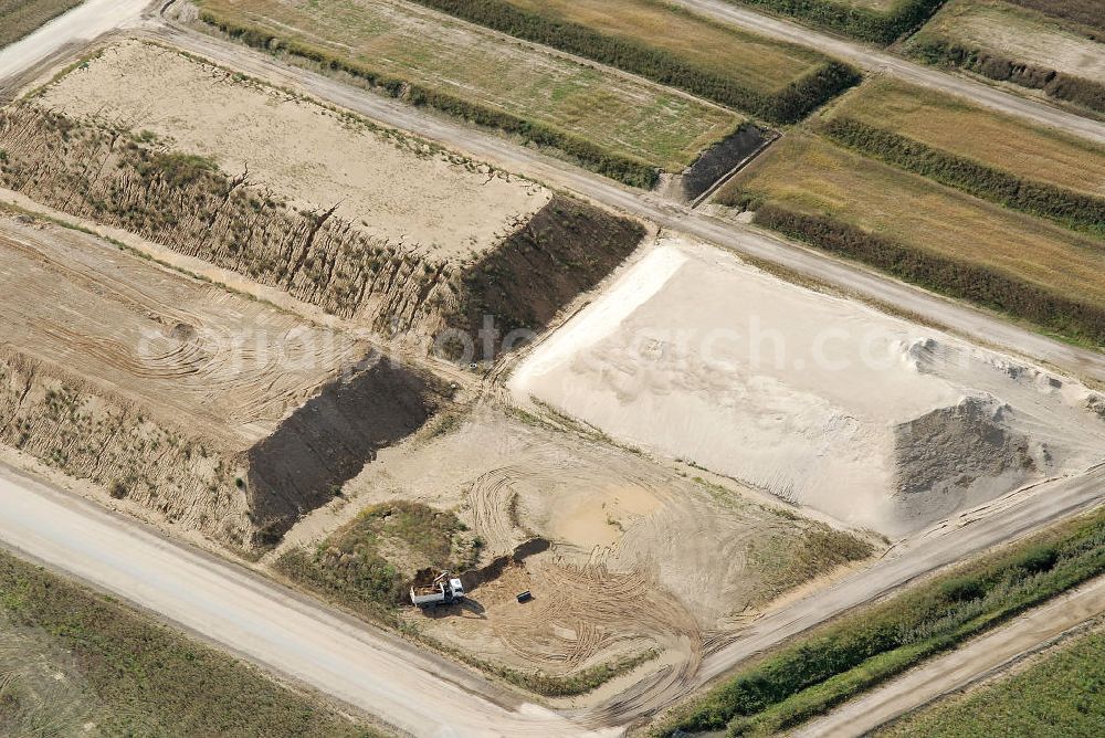 Schönefeld from the bird's eye view: Baustelle des neuen Terminals am Flughafen Schönefeld (BBI). Der neue Terminal wird südlich des jetzigen Flughafens Berlin- Schönefeld errichtet. Ausführende Firmen: Hochtief AG; EUROVIA Beton; PORR; BERGER Bau; Karl Weiss; Matthai; Schäler Bau Berlin GmbH; STRABAG; MAX BÖGL. Construction area of the new terminal at Schönefeld Airport (BBI). The new terminal is in the south of the airport Berlin-Schoenefeld quality built. Exporting companies: Hochtief AG; EUROVIA Beton; PORR; BERGER Bau; Karl Weiss; Matthai; Schäler Bau Berlin GmbH; STRABAG; MAX BÖGL.