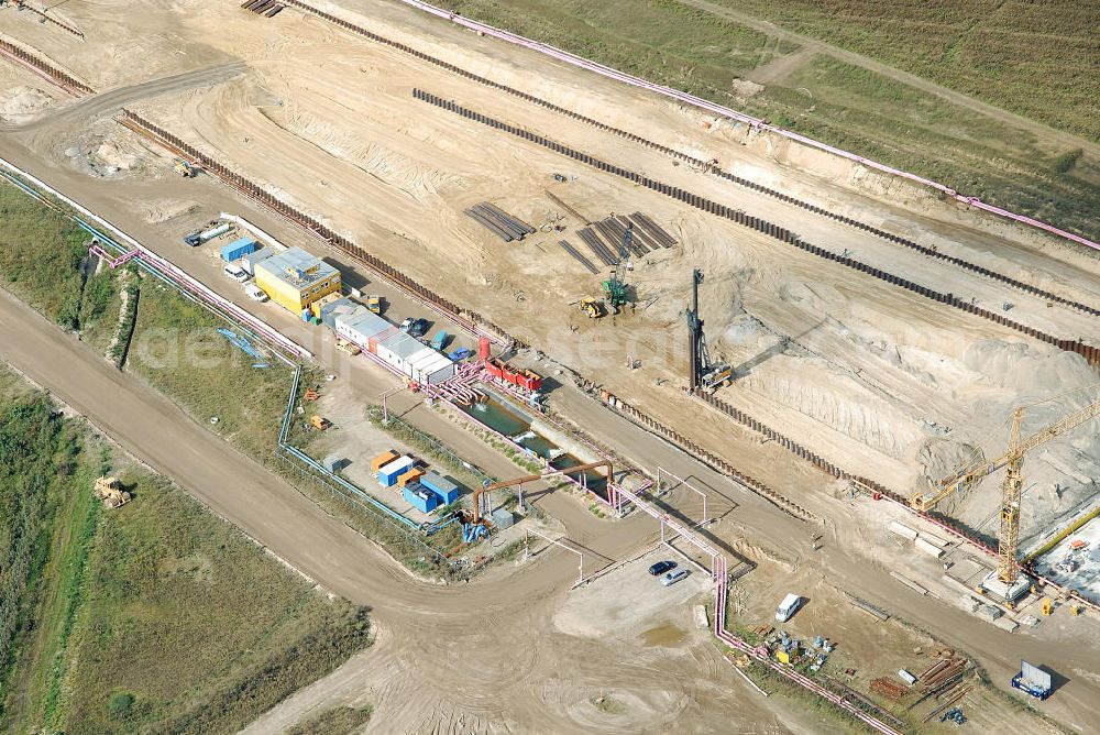 Aerial image Schönefeld - Baustelle des neuen Terminals am Flughafen Schönefeld (BBI). Der neue Terminal wird südlich des jetzigen Flughafens Berlin- Schönefeld errichtet. Ausführende Firmen: Hochtief AG; EUROVIA Beton; PORR; BERGER Bau; Karl Weiss; Matthai; Schäler Bau Berlin GmbH; STRABAG; MAX BÖGL. Construction area of the new terminal at Schönefeld Airport (BBI). The new terminal is in the south of the airport Berlin-Schoenefeld quality built. Exporting companies: Hochtief AG; EUROVIA Beton; PORR; BERGER Bau; Karl Weiss; Matthai; Schäler Bau Berlin GmbH; STRABAG; MAX BÖGL.