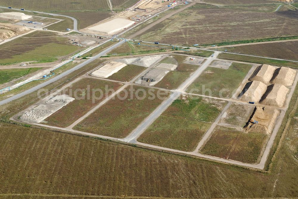 Schönefeld from above - Baustelle des neuen Terminals am Flughafen Schönefeld (BBI). Der neue Terminal wird südlich des jetzigen Flughafens Berlin- Schönefeld errichtet. Ausführende Firmen: Hochtief AG; EUROVIA Beton; PORR; BERGER Bau; Karl Weiss; Matthai; Schäler Bau Berlin GmbH; STRABAG; MAX BÖGL. Construction area of the new terminal at Schönefeld Airport (BBI). The new terminal is in the south of the airport Berlin-Schoenefeld quality built. Exporting companies: Hochtief AG; EUROVIA Beton; PORR; BERGER Bau; Karl Weiss; Matthai; Schäler Bau Berlin GmbH; STRABAG; MAX BÖGL.