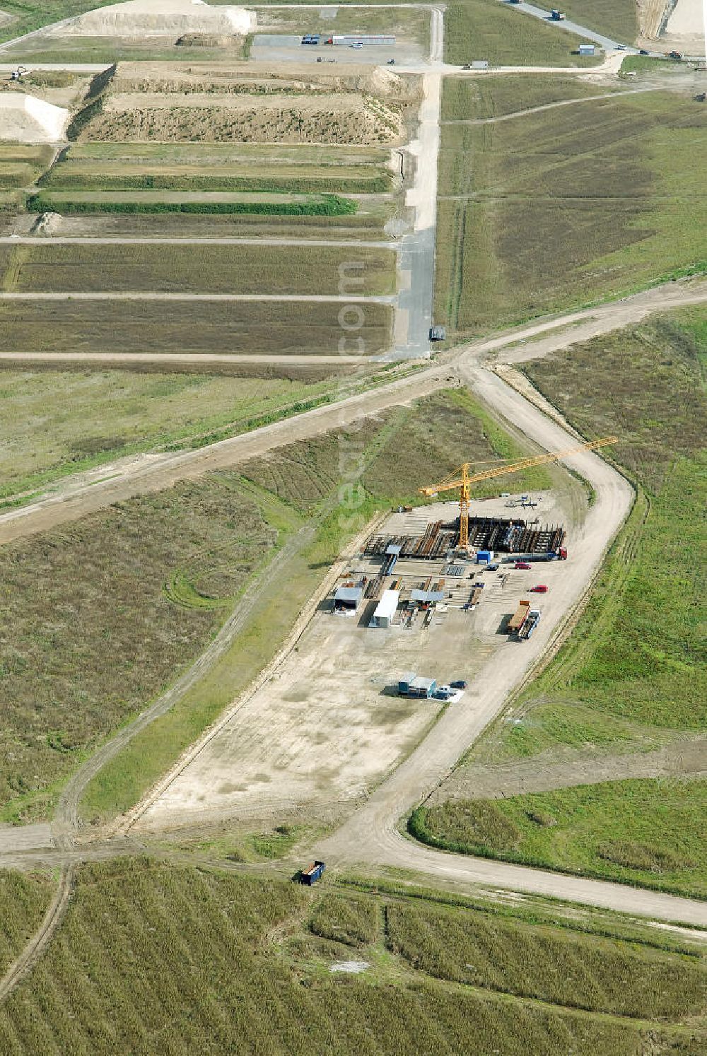 Aerial image Schönefeld - Baustelle des neuen Terminals am Flughafen Schönefeld (BBI). Der neue Terminal wird südlich des jetzigen Flughafens Berlin- Schönefeld errichtet. Ausführende Firmen: Hochtief AG; EUROVIA Beton; PORR; BERGER Bau; Karl Weiss; Matthai; Schäler Bau Berlin GmbH; STRABAG; MAX BÖGL. Construction area of the new terminal at Schönefeld Airport (BBI). The new terminal is in the south of the airport Berlin-Schoenefeld quality built. Exporting companies: Hochtief AG; EUROVIA Beton; PORR; BERGER Bau; Karl Weiss; Matthai; Schäler Bau Berlin GmbH; STRABAG; MAX BÖGL.