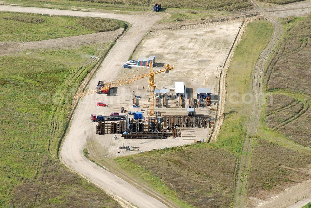 Schönefeld from above - Baustelle des neuen Terminals am Flughafen Schönefeld (BBI). Der neue Terminal wird südlich des jetzigen Flughafens Berlin- Schönefeld errichtet. Ausführende Firmen: Hochtief AG; EUROVIA Beton; PORR; BERGER Bau; Karl Weiss; Matthai; Schäler Bau Berlin GmbH; STRABAG; MAX BÖGL. Construction area of the new terminal at Schönefeld Airport (BBI). The new terminal is in the south of the airport Berlin-Schoenefeld quality built. Exporting companies: Hochtief AG; EUROVIA Beton; PORR; BERGER Bau; Karl Weiss; Matthai; Schäler Bau Berlin GmbH; STRABAG; MAX BÖGL.