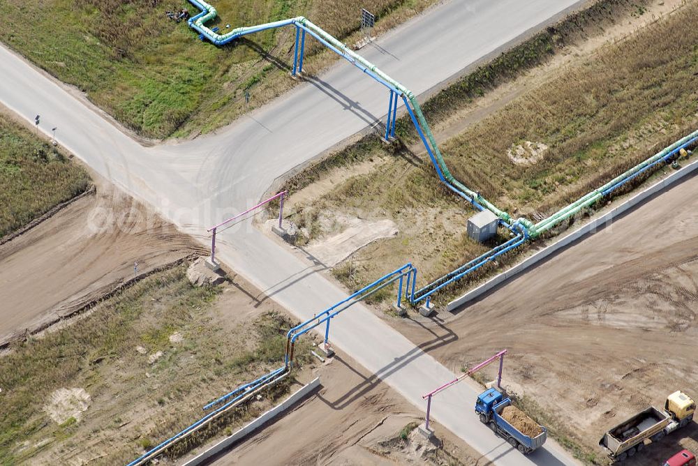 Schönefeld from the bird's eye view: Baustelle des neuen Terminals am Flughafen Schönefeld (BBI). Der neue Terminal wird südlich des jetzigen Flughafens Berlin- Schönefeld errichtet. Ausführende Firmen: Hochtief AG; EUROVIA Beton; PORR; BERGER Bau; Karl Weiss; Matthai; Schäler Bau Berlin GmbH; STRABAG; MAX BÖGL. Construction area of the new terminal at Schönefeld Airport (BBI). The new terminal is in the south of the airport Berlin-Schoenefeld quality built. Exporting companies: Hochtief AG; EUROVIA Beton; PORR; BERGER Bau; Karl Weiss; Matthai; Schäler Bau Berlin GmbH; STRABAG; MAX BÖGL.