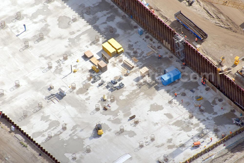 Aerial image Schönefeld - Baustelle des neuen Terminals am Flughafen Schönefeld (BBI). Der neue Terminal wird südlich des jetzigen Flughafens Berlin- Schönefeld errichtet. Ausführende Firmen: Hochtief AG; EUROVIA Beton; PORR; BERGER Bau; Karl Weiss; Matthai; Schäler Bau Berlin GmbH; STRABAG; MAX BÖGL. Construction area of the new terminal at Schönefeld Airport (BBI). The new terminal is in the south of the airport Berlin-Schoenefeld quality built. Exporting companies: Hochtief AG; EUROVIA Beton; PORR; BERGER Bau; Karl Weiss; Matthai; Schäler Bau Berlin GmbH; STRABAG; MAX BÖGL.