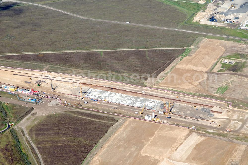 Aerial photograph Schönefeld - Baustelle des neuen Terminals am Flughafen Schönefeld (BBI). Der neue Terminal wird südlich des jetzigen Flughafens Berlin- Schönefeld errichtet. Ausführende Firmen: Hochtief AG; EUROVIA Beton; PORR; BERGER Bau; Karl Weiss; Matthai; Schäler Bau Berlin GmbH; STRABAG; MAX BÖGL. Construction area of the new terminal at Schönefeld Airport (BBI). The new terminal is in the south of the airport Berlin-Schoenefeld quality built. Exporting companies: Hochtief AG; EUROVIA Beton; PORR; BERGER Bau; Karl Weiss; Matthai; Schäler Bau Berlin GmbH; STRABAG; MAX BÖGL.