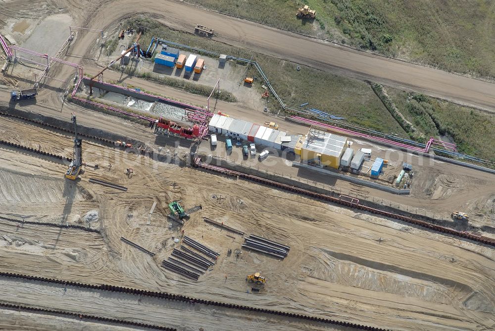 Schönefeld from above - Baustelle des neuen Terminals am Flughafen Schönefeld (BBI). Der neue Terminal wird südlich des jetzigen Flughafens Berlin- Schönefeld errichtet. Ausführende Firmen: Hochtief AG; EUROVIA Beton; PORR; BERGER Bau; Karl Weiss; Matthai; Schäler Bau Berlin GmbH; STRABAG; MAX BÖGL. Construction area of the new terminal at Schönefeld Airport (BBI). The new terminal is in the south of the airport Berlin-Schoenefeld quality built. Exporting companies: Hochtief AG; EUROVIA Beton; PORR; BERGER Bau; Karl Weiss; Matthai; Schäler Bau Berlin GmbH; STRABAG; MAX BÖGL.