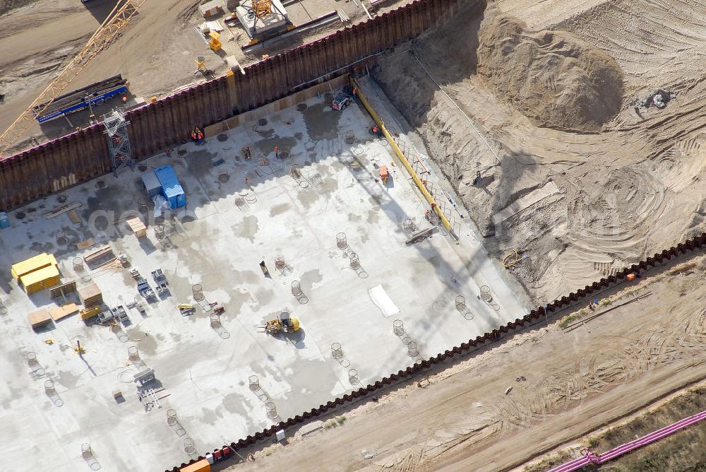 Schönefeld from the bird's eye view: Baustelle des neuen Terminals am Flughafen Schönefeld (BBI). Der neue Terminal wird südlich des jetzigen Flughafens Berlin- Schönefeld errichtet. Ausführende Firmen: Hochtief AG; EUROVIA Beton; PORR; BERGER Bau; Karl Weiss; Matthai; Schäler Bau Berlin GmbH; STRABAG; MAX BÖGL. Construction area of the new terminal at Schönefeld Airport (BBI). The new terminal is in the south of the airport Berlin-Schoenefeld quality built. Exporting companies: Hochtief AG; EUROVIA Beton; PORR; BERGER Bau; Karl Weiss; Matthai; Schäler Bau Berlin GmbH; STRABAG; MAX BÖGL.