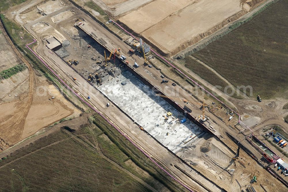 Aerial image Schönefeld - Baustelle des neuen Terminals am Flughafen Schönefeld (BBI). Der neue Terminal wird südlich des jetzigen Flughafens Berlin- Schönefeld errichtet. Ausführende Firmen: Hochtief AG; EUROVIA Beton; PORR; BERGER Bau; Karl Weiss; Matthai; Schäler Bau Berlin GmbH; STRABAG; MAX BÖGL. Construction area of the new terminal at Schönefeld Airport (BBI). The new terminal is in the south of the airport Berlin-Schoenefeld quality built. Exporting companies: Hochtief AG; EUROVIA Beton; PORR; BERGER Bau; Karl Weiss; Matthai; Schäler Bau Berlin GmbH; STRABAG; MAX BÖGL.