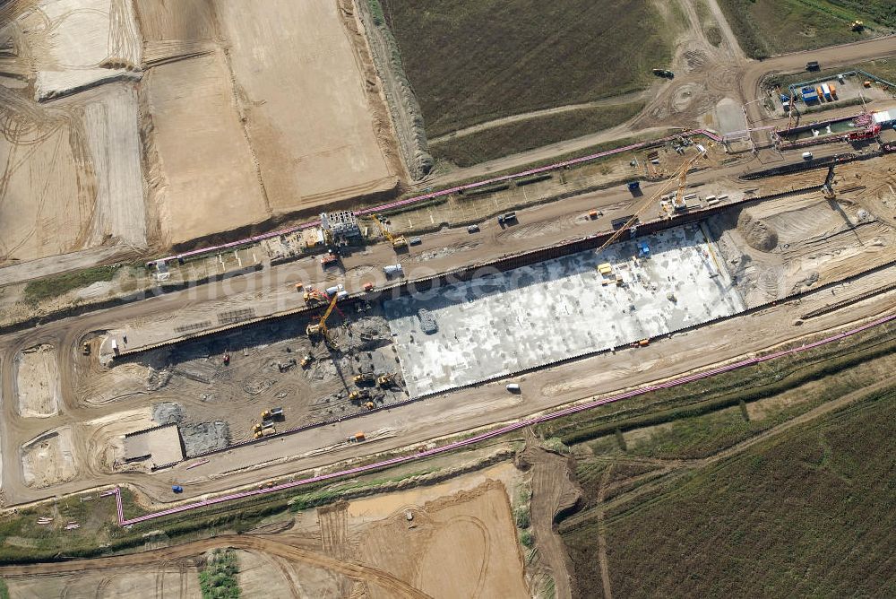 Schönefeld from above - Baustelle des neuen Terminals am Flughafen Schönefeld (BBI). Der neue Terminal wird südlich des jetzigen Flughafens Berlin- Schönefeld errichtet. Ausführende Firmen: Hochtief AG; EUROVIA Beton; PORR; BERGER Bau; Karl Weiss; Matthai; Schäler Bau Berlin GmbH; STRABAG; MAX BÖGL. Construction area of the new terminal at Schönefeld Airport (BBI). The new terminal is in the south of the airport Berlin-Schoenefeld quality built. Exporting companies: Hochtief AG; EUROVIA Beton; PORR; BERGER Bau; Karl Weiss; Matthai; Schäler Bau Berlin GmbH; STRABAG; MAX BÖGL.