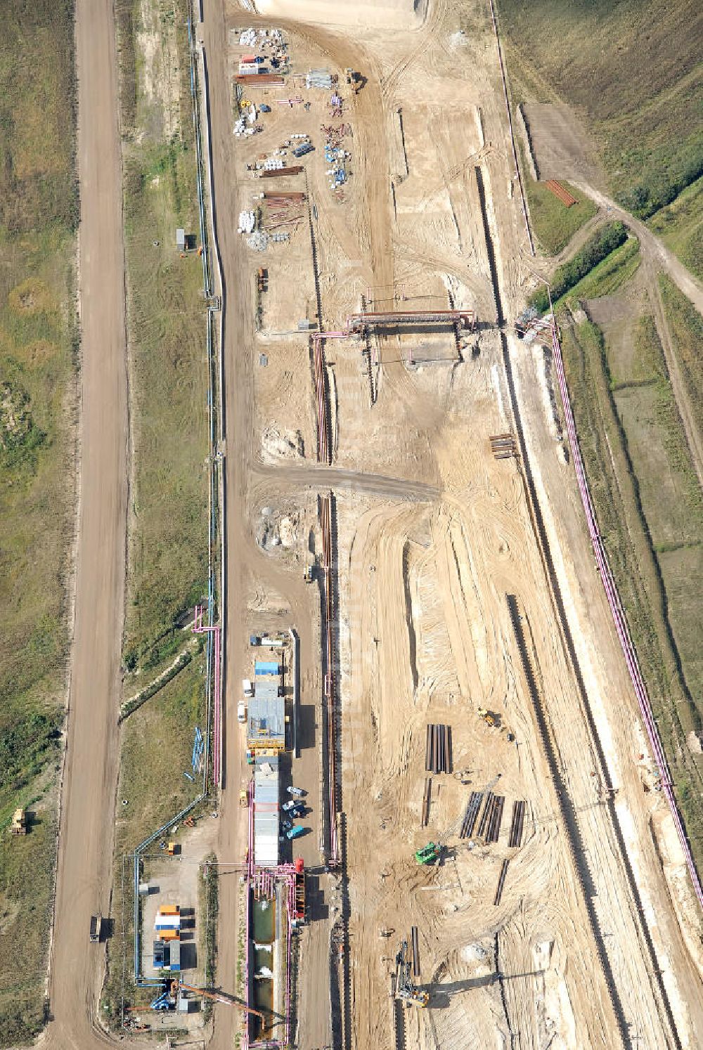 Aerial image Schönefeld - Baustelle des neuen Terminals am Flughafen Schönefeld (BBI). Der neue Terminal wird südlich des jetzigen Flughafens Berlin- Schönefeld errichtet. Ausführende Firmen: Hochtief AG; EUROVIA Beton; PORR; BERGER Bau; Karl Weiss; Matthai; Schäler Bau Berlin GmbH; STRABAG; MAX BÖGL. Construction area of the new terminal at Schönefeld Airport (BBI). The new terminal is in the south of the airport Berlin-Schoenefeld quality built. Exporting companies: Hochtief AG; EUROVIA Beton; PORR; BERGER Bau; Karl Weiss; Matthai; Schäler Bau Berlin GmbH; STRABAG; MAX BÖGL.