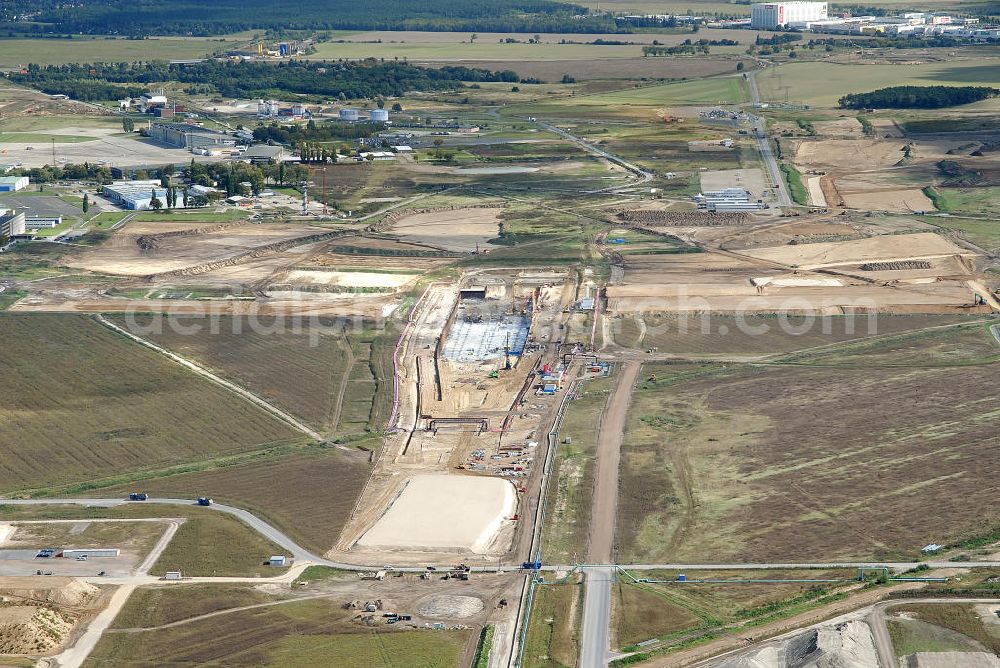 Aerial photograph Schönefeld - Baustelle des neuen Terminals am Flughafen Schönefeld (BBI). Der neue Terminal wird südlich des jetzigen Flughafens Berlin- Schönefeld errichtet. Ausführende Firmen: Hochtief AG; EUROVIA Beton; PORR; BERGER Bau; Karl Weiss; Matthai; Schäler Bau Berlin GmbH; STRABAG; MAX BÖGL. Construction area of the new terminal at Schönefeld Airport (BBI). The new terminal is in the south of the airport Berlin-Schoenefeld quality built. Exporting companies: Hochtief AG; EUROVIA Beton; PORR; BERGER Bau; Karl Weiss; Matthai; Schäler Bau Berlin GmbH; STRABAG; MAX BÖGL.