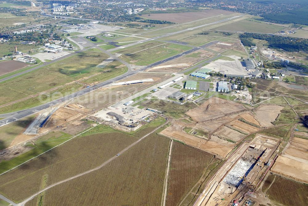 Aerial image Schönefeld - Baustelle des neuen Terminals am Flughafen Schönefeld (BBI). Der neue Terminal wird südlich des jetzigen Flughafens Berlin- Schönefeld errichtet. Ausführende Firmen: Hochtief AG; EUROVIA Beton; PORR; BERGER Bau; Karl Weiss; Matthai; Schäler Bau Berlin GmbH; STRABAG; MAX BÖGL. Construction area of the new terminal at Schönefeld Airport (BBI). The new terminal is in the south of the airport Berlin-Schoenefeld quality built. Exporting companies: Hochtief AG; EUROVIA Beton; PORR; BERGER Bau; Karl Weiss; Matthai; Schäler Bau Berlin GmbH; STRABAG; MAX BÖGL.