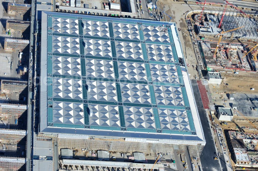 Schönefeld from above - Baustelle des neuen Terminals am Flughafen Schönefeld (BBI). Der neue Terminal wird südlich des jetzigen Flughafens Berlin- Schönefeld errichtet. Ausführende Firmen: Hochtief AG; EUROVIA Beton; PORR; BERGER Bau; Karl Weiss; Matthai; Schäler Bau Berlin GmbH; STRABAG; Construction area of the new terminal at Schönefeld Airport (BBI). The new terminal is in the south of the airport Berlin-Schoenefeld quality built. Exporting companies: Hochtief AG; EUROVIA Beton; PORR; BERGER Bau; Karl Weiss; Matthai; Schäler Bau Berlin GmbH; STRABAG;