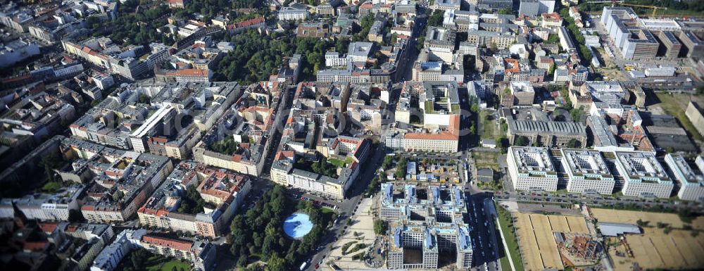 Berlin from the bird's eye view: Blick auf die Baustelle am Nordbahnhof. Hier entsteht das Nordbahnhof Carrée, ein Bürogebäude der Deutschen Bahn AG gebaut durch die Firma FRANKONIA Eurobau AG. Die FRANKONIA Eurobau AG und ihr Projektpartner, der LVM Landwirtschaftlicher Versicherungsverein Münster a.G., haben den von FRANKONIA entwickelten Büroneubau „Nordbahnhof Carrée in Berlin an den Immobilienfonds Euroffice der französischen Investmentgesellschaft AEW Europe verkauft. View on the construction area at the Nordbahnhof. Here the Nordbahnhof Carree is erected an office builing of the Deutsche Bahn AG constructed by FRANKONIA Eurobau AG.