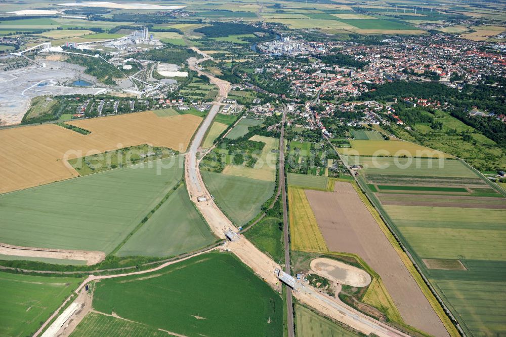 Bernburg from the bird's eye view: Baustelle vom Neubau der Ortsumgehung Bernburg Bundesstraße B 6n mit Anschlußstelle an die Autobahn / Bundesautobahn A 14 in Sachsen-Anhalt. Ein Projekt von EUROVIA. Construction site of the new circuitous road B6n Bernburg with the new junction on to the freeway in the near of Bernburg in Saxony-Anhalt.