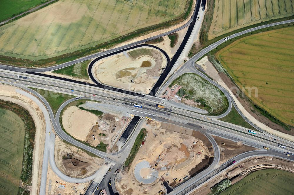 Bernburg from the bird's eye view: Baustelle vom Neubau der Ortsumgehung Bernburg Bundesstraße B 6n mit Anschlußstelle an die Autobahn / Bundesautobahn A 14 in Sachsen-Anhalt. Ein Projekt von EUROVIA. Construction site of the new circuitous road B6n Bernburg with the new junction on to the freeway in the near of Bernburg in Saxony-Anhalt.