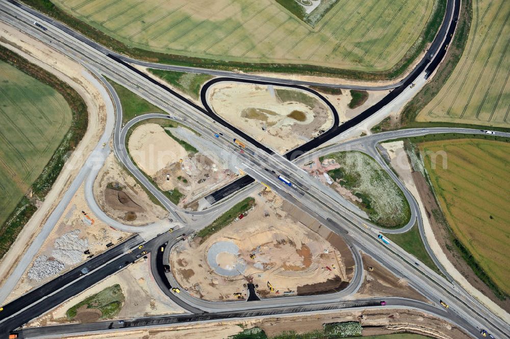 Aerial image Bernburg - Baustelle vom Neubau der Ortsumgehung Bernburg Bundesstraße B 6n mit Anschlußstelle an die Autobahn / Bundesautobahn A 14 in Sachsen-Anhalt. Ein Projekt von EUROVIA. Construction site of the new circuitous road B6n Bernburg with the new junction on to the freeway in the near of Bernburg in Saxony-Anhalt.