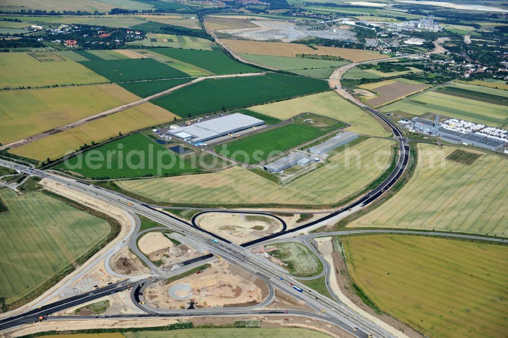 Bernburg from the bird's eye view: Baustelle vom Neubau der Ortsumgehung Bernburg Bundesstraße B 6n mit Anschlußstelle an die Autobahn / Bundesautobahn A 14 in Sachsen-Anhalt. Ein Projekt von EUROVIA. Construction site of the new circuitous road B6n Bernburg with the new junction on to the freeway in the near of Bernburg in Saxony-Anhalt.