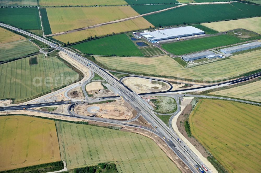 Aerial image Bernburg - Baustelle vom Neubau der Ortsumgehung Bernburg Bundesstraße B 6n mit Anschlußstelle an die Autobahn / Bundesautobahn A 14 in Sachsen-Anhalt. Ein Projekt von EUROVIA. Construction site of the new circuitous road B6n Bernburg with the new junction on to the freeway in the near of Bernburg in Saxony-Anhalt.