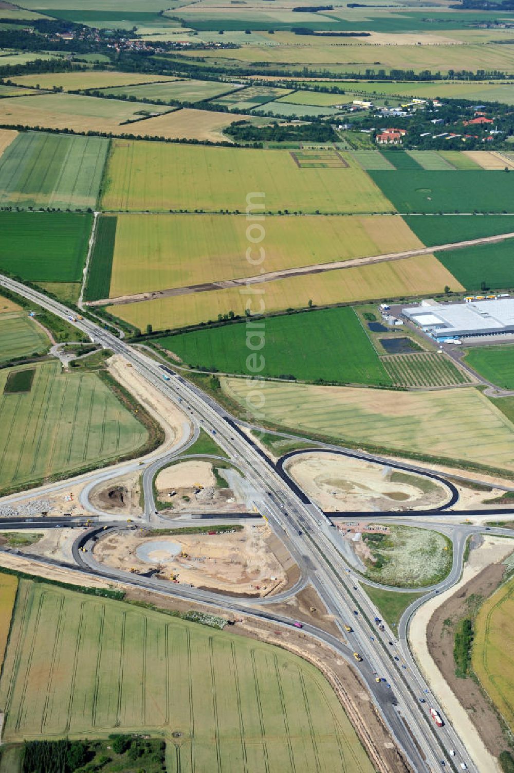 Aerial photograph Bernburg - Baustelle vom Neubau der Ortsumgehung Bernburg Bundesstraße B 6n mit Anschlußstelle an die Autobahn / Bundesautobahn A 14 in Sachsen-Anhalt. Ein Projekt von EUROVIA. Construction site of the new circuitous road B6n Bernburg with the new junction on to the freeway in the near of Bernburg in Saxony-Anhalt.