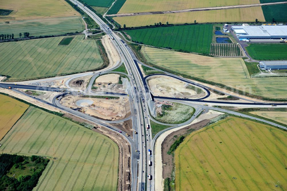 Bernburg from the bird's eye view: Baustelle vom Neubau der Ortsumgehung Bernburg Bundesstraße B 6n mit Anschlußstelle an die Autobahn / Bundesautobahn A 14 in Sachsen-Anhalt. Ein Projekt von EUROVIA. Construction site of the new circuitous road B6n Bernburg with the new junction on to the freeway in the near of Bernburg in Saxony-Anhalt.