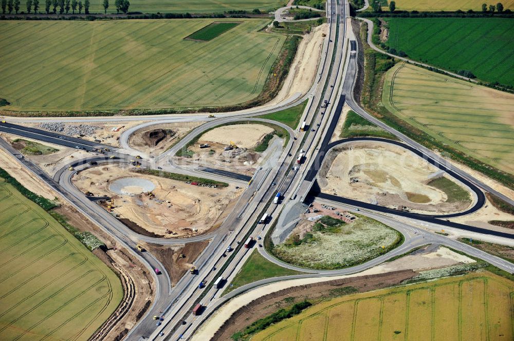 Aerial image Bernburg - Baustelle vom Neubau der Ortsumgehung Bernburg Bundesstraße B 6n mit Anschlußstelle an die Autobahn / Bundesautobahn A 14 in Sachsen-Anhalt. Ein Projekt von EUROVIA. Construction site of the new circuitous road B6n Bernburg with the new junction on to the freeway in the near of Bernburg in Saxony-Anhalt.