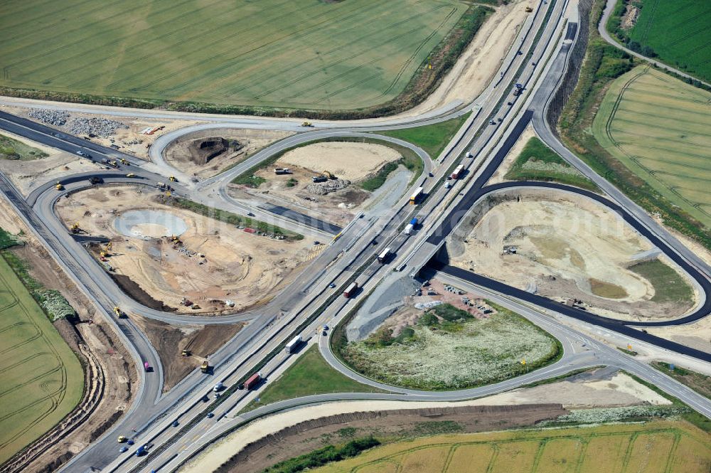 Aerial photograph Bernburg - Baustelle vom Neubau der Ortsumgehung Bernburg Bundesstraße B 6n mit Anschlußstelle an die Autobahn / Bundesautobahn A 14 in Sachsen-Anhalt. Ein Projekt von EUROVIA. Construction site of the new circuitous road B6n Bernburg with the new junction on to the freeway in the near of Bernburg in Saxony-Anhalt.