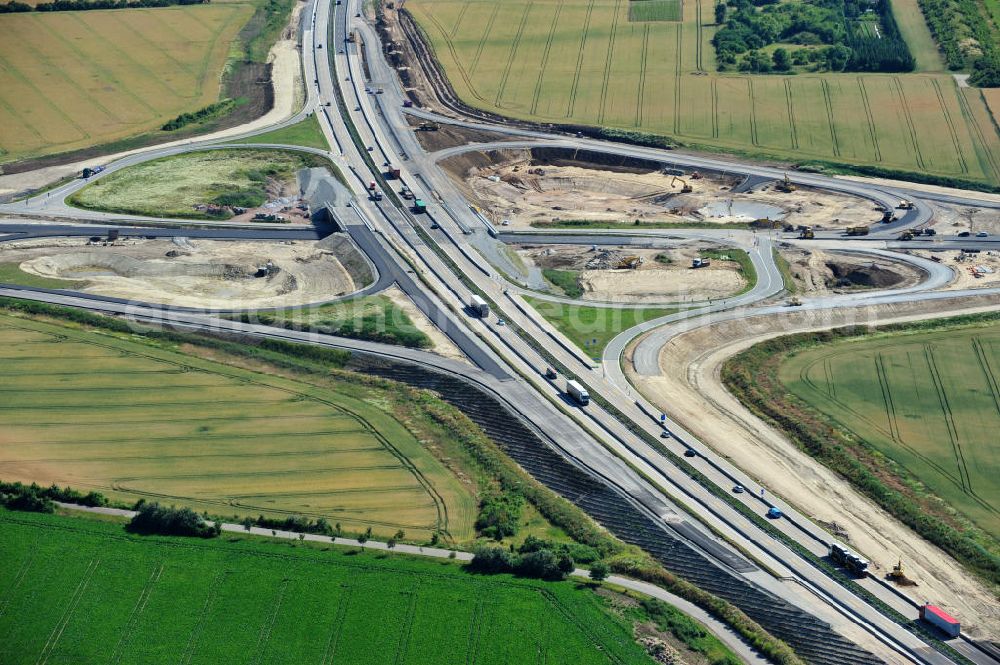 Bernburg from the bird's eye view: Baustelle vom Neubau der Ortsumgehung Bernburg Bundesstraße B 6n mit Anschlußstelle an die Autobahn / Bundesautobahn A 14 in Sachsen-Anhalt. Ein Projekt von EUROVIA. Construction site of the new circuitous road B6n Bernburg with the new junction on to the freeway in the near of Bernburg in Saxony-Anhalt.