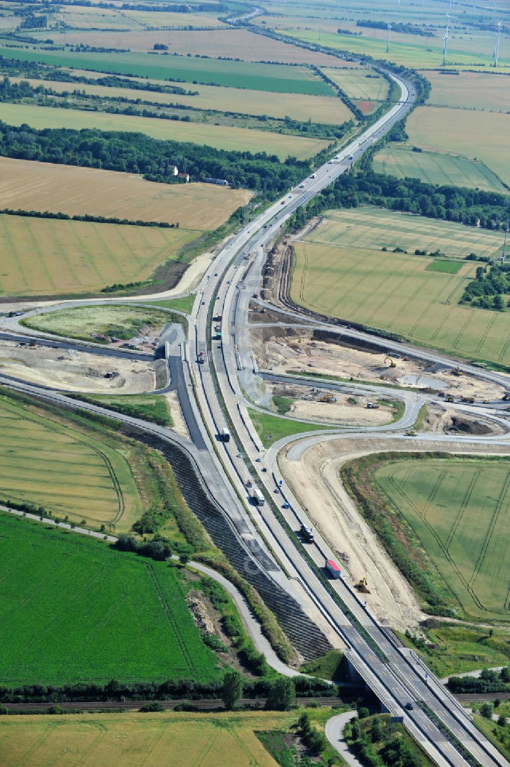 Aerial image Bernburg - Baustelle vom Neubau der Ortsumgehung Bernburg Bundesstraße B 6n mit Anschlußstelle an die Autobahn / Bundesautobahn A 14 in Sachsen-Anhalt. Ein Projekt von EUROVIA. Construction site of the new circuitous road B6n Bernburg with the new junction on to the freeway in the near of Bernburg in Saxony-Anhalt.