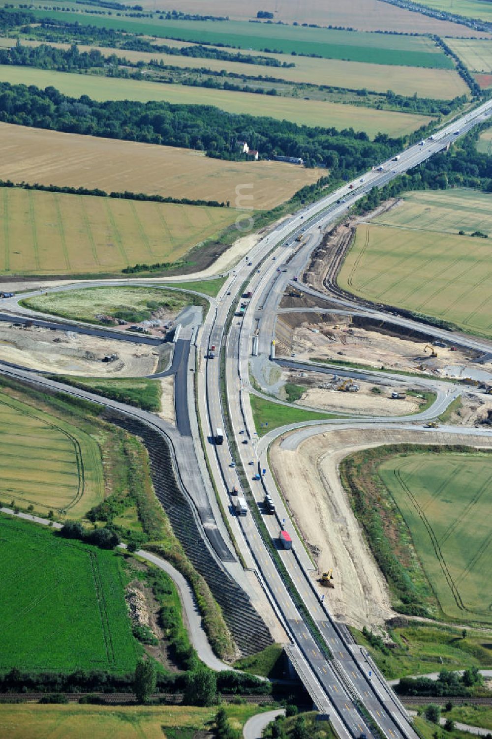 Aerial photograph Bernburg - Baustelle vom Neubau der Ortsumgehung Bernburg Bundesstraße B 6n mit Anschlußstelle an die Autobahn / Bundesautobahn A 14 in Sachsen-Anhalt. Ein Projekt von EUROVIA. Construction site of the new circuitous road B6n Bernburg with the new junction on to the freeway in the near of Bernburg in Saxony-Anhalt.