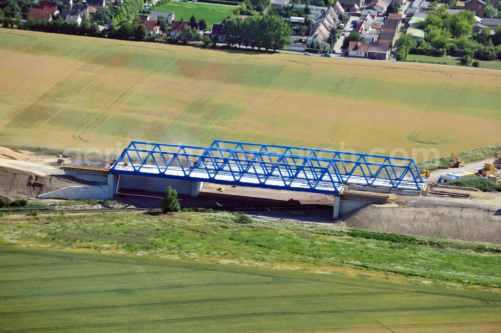 Bernburg from the bird's eye view: Baustelle vom Neubau der Ortsumgehung Bernburg Bundesstraße B 6n mit Anschlußstelle an die Autobahn / Bundesautobahn A 14 in Sachsen-Anhalt. Ein Projekt von EUROVIA. Construction site of the new circuitous road B6n Bernburg with the new junction on to the freeway in the near of Bernburg in Saxony-Anhalt.