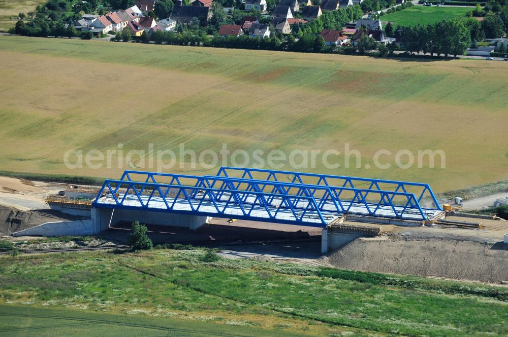 Aerial image Bernburg - Baustelle vom Neubau der Ortsumgehung Bernburg Bundesstraße B 6n mit Anschlußstelle an die Autobahn / Bundesautobahn A 14 in Sachsen-Anhalt. Ein Projekt von EUROVIA. Construction site of the new circuitous road B6n Bernburg with the new junction on to the freeway in the near of Bernburg in Saxony-Anhalt.