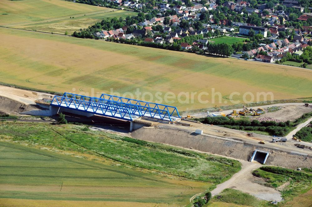 Aerial photograph Bernburg - Baustelle vom Neubau der Ortsumgehung Bernburg Bundesstraße B 6n mit Anschlußstelle an die Autobahn / Bundesautobahn A 14 in Sachsen-Anhalt. Ein Projekt von EUROVIA. Construction site of the new circuitous road B6n Bernburg with the new junction on to the freeway in the near of Bernburg in Saxony-Anhalt.