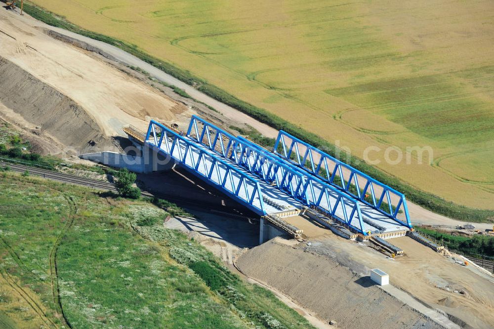 Bernburg from above - Baustelle vom Neubau der Ortsumgehung Bernburg Bundesstraße B 6n mit Anschlußstelle an die Autobahn / Bundesautobahn A 14 in Sachsen-Anhalt. Ein Projekt von EUROVIA. Construction site of the new circuitous road B6n Bernburg with the new junction on to the freeway in the near of Bernburg in Saxony-Anhalt.