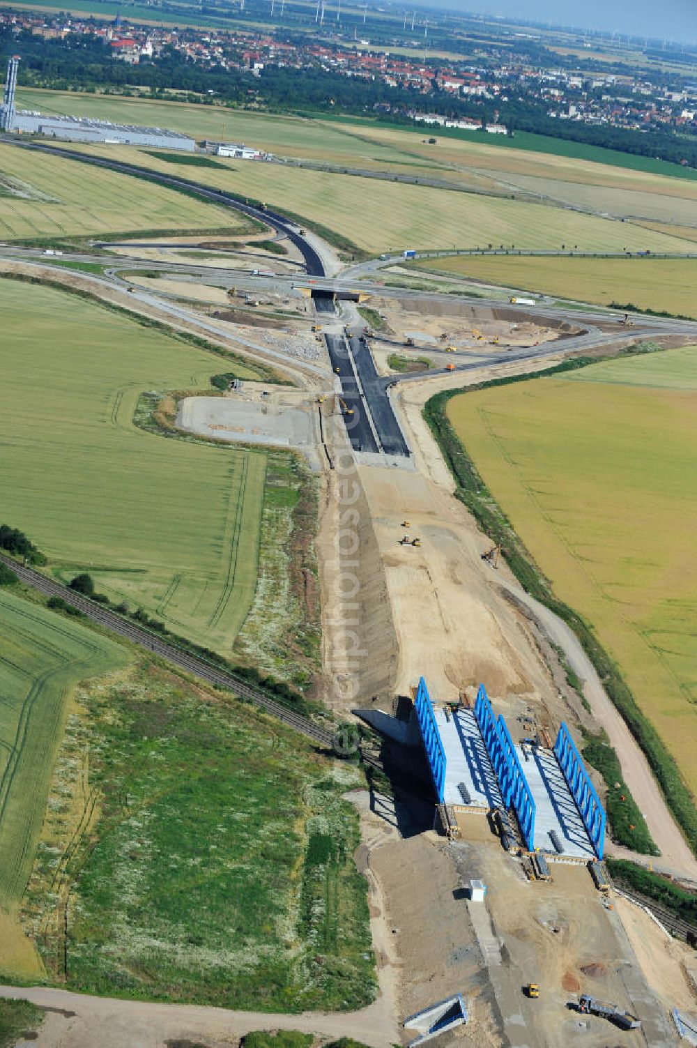 Aerial image Bernburg - Baustelle vom Neubau der Ortsumgehung Bernburg Bundesstraße B 6n mit Anschlußstelle an die Autobahn / Bundesautobahn A 14 in Sachsen-Anhalt. Ein Projekt von EUROVIA. Construction site of the new circuitous road B6n Bernburg with the new junction on to the freeway in the near of Bernburg in Saxony-Anhalt.